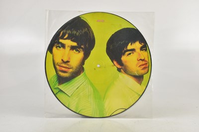 Lot 1076 - OASIS; two albums comprising (What's The...