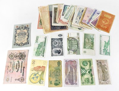 Lot 535 - A collection of UK and international banknotes...