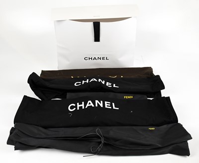 Lot 798 - CHANEL; two black cotton garment bags with...
