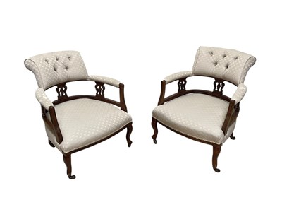 Lot 235 - A pair of Edwardian tub chairs upholstered in...