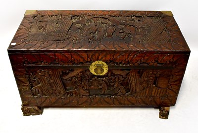 Lot 80 - An oriental carved camphor wood chest, with...