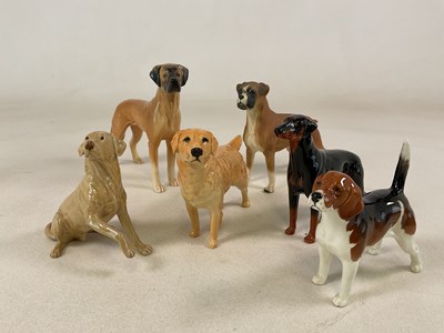 Lot 202 - BESWICK; three dogs and three other dogs by...