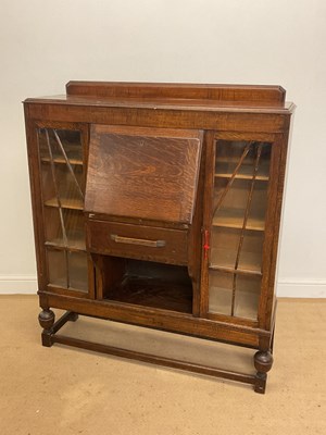 Lot 503 - An early 20th century oak drop-front bureau...