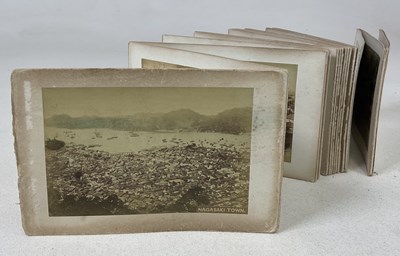 Lot 258 - A Japanese concertina style photograph album...