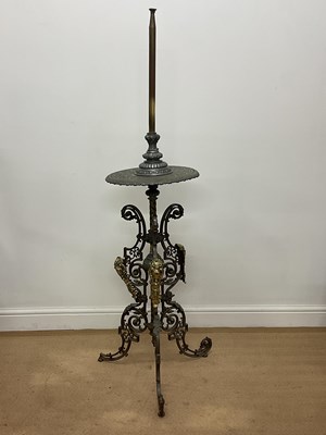 Lot 106 - A decorative brass and cast metal standard...