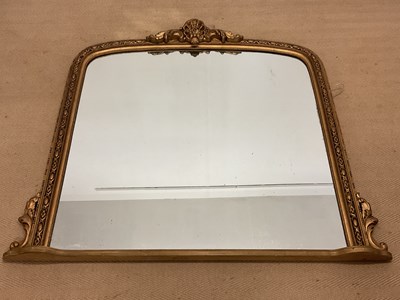 Lot 402 - A gilt overmantel mirror with carved frame,...