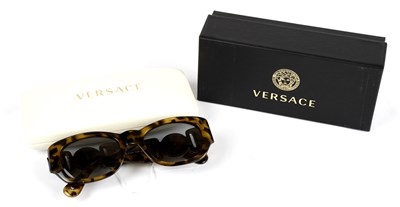 Lot 802 - VERSACE; a pair of tortoiseshell prescription...