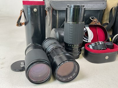 Lot 315 - A quantity of cameras, lenses and a pair of...