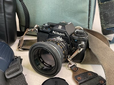 Lot 315 - A quantity of cameras, lenses and a pair of...