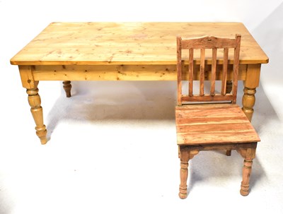 Lot 26 - A waxed pine dining table, on turned legs, 77...