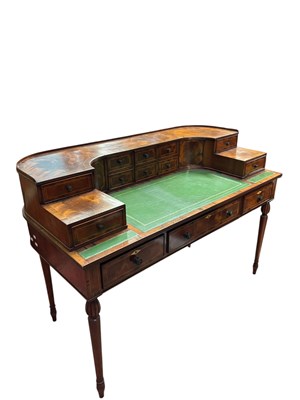 Lot 53A - A walnut and rosewood Carlton House style desk,...