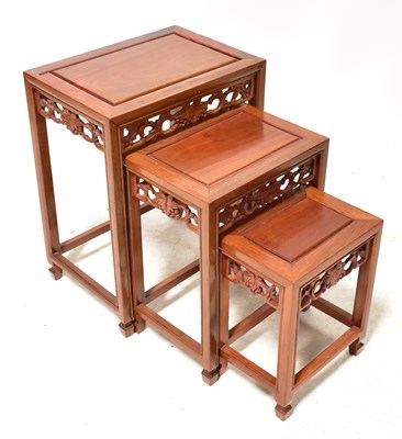 Lot 19 - A Chinese-style hardwood nest of three tables...