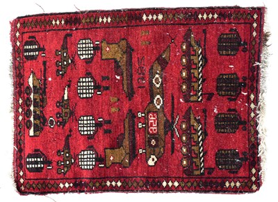 Lot 150 - An Afghan rug with helicopter, grenade and...