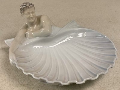 Lot 126 - ROYAL COPENHAGEN; a merman with shell bowl,...