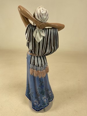 Lot 127 - DAHL JENSEN FOR COPENHAGEN; a porcelain figure...