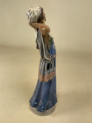 Lot 127 - DAHL JENSEN FOR COPENHAGEN; a porcelain figure...