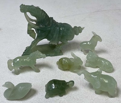 Lot 372 - A group of Chinese jade and similar carvings...