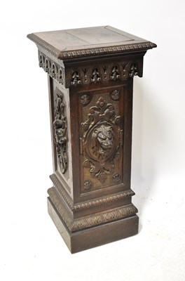 Lot 125 - A Victorian ornate carved oak pedestal, the...