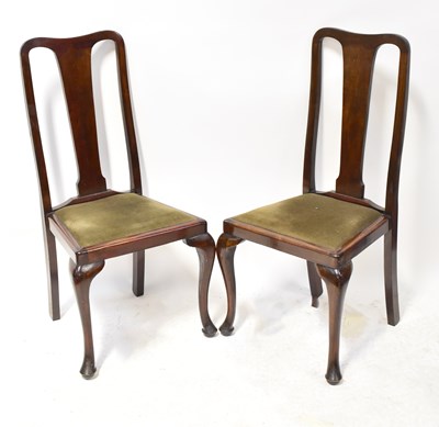 Lot 39 - A set of four walnut Queen Anne style dining...