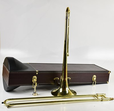 Lot 1036 - BOOSEY & HAWKES; a cased trombone.