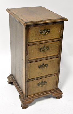 Lot 74 - A Georgian walnut crossbanded narrow chest of...