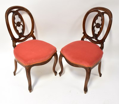 Lot 36 - A pair of Edwardian mahogany balloon-back...