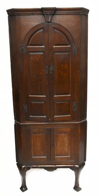 Lot 2960 - A Georgian oak freestanding corner cupboard...