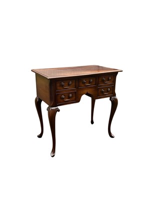 Lot 1079 - A reproduction mahogany low boy, with five...