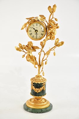 Lot 1242 - L'ORIGINALE; a reproduction gilt metal and...