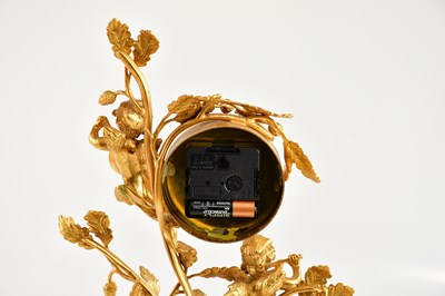 Lot 1242 - L'ORIGINALE; a reproduction gilt metal and...