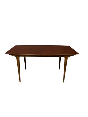 Lot 4 - A mid century teak dining suite comprising...