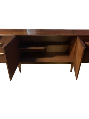 Lot 4 - A mid century teak dining suite comprising...