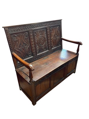 Lot 91 - An 18th century style oak settle, with carved...