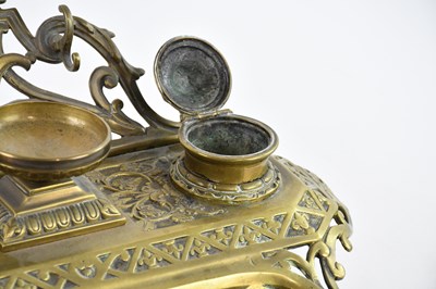 Lot 775 - A 19th century brass desk tidy with floral and...