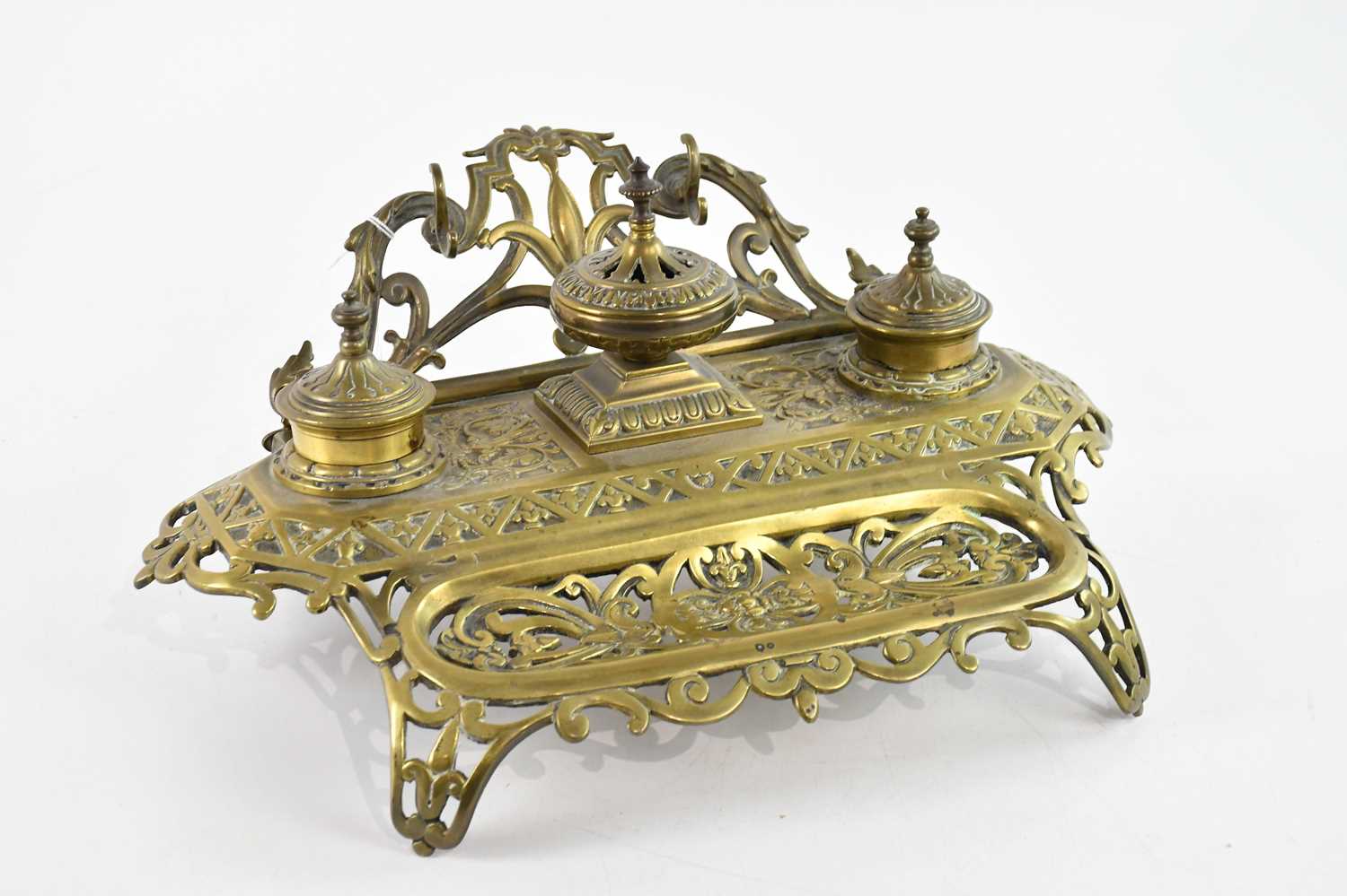 Lot 775 - A 19th century brass desk tidy with floral and...