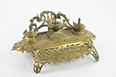 Lot 775 - A 19th century brass desk tidy with floral and...