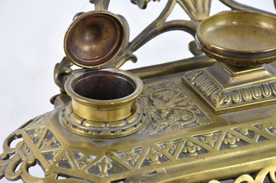 Lot 775 - A 19th century brass desk tidy with floral and...
