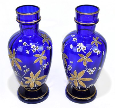 Lot 477 - A pair of late Victorian blue glass vases,...