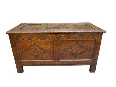 Lot 105 - An 18th century carved and panelled oak coffer,...