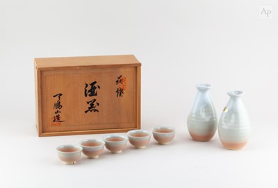 Lot 749 - A Japanese Tohsai sake set covered in pale...