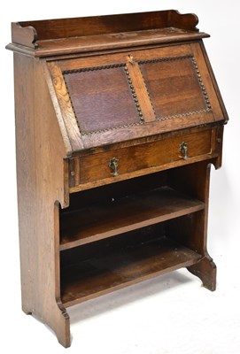 Lot 119 - A 1930s oak students' desk, with moulded...