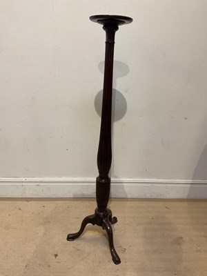 Lot 60 - A reproduction mahogany torchere stand on...