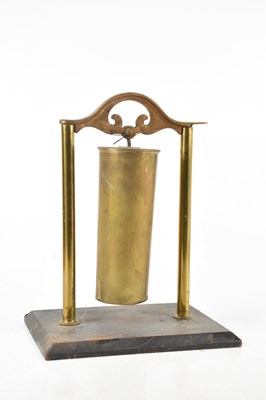 Lot 785 - A decorative brass dinner gong, modelled as a...