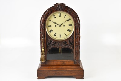 Lot 1233 - A 19th century rosewood arch top mantel clock...