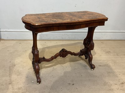 Lot 233 - A Victorian walnut serpentine fronted foldover...