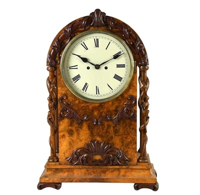 Lot 1223 - A Victorian burr walnut mantel clock of arched...