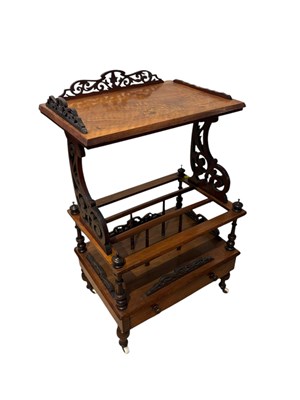 Lot 244 - A Victorian walnut Canterbury whatnot with...