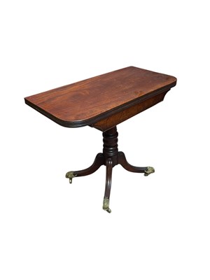 Lot 228 - A 19th century mahogany foldover tea table on...