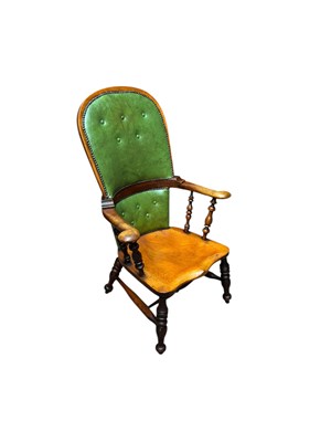 Lot 104 - A 19th century elm seated Windsor elbow chair...