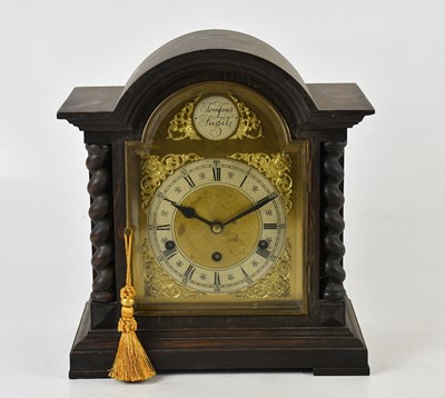 Lot 1246 - A 1920s oak bracket clock, the dial set with...